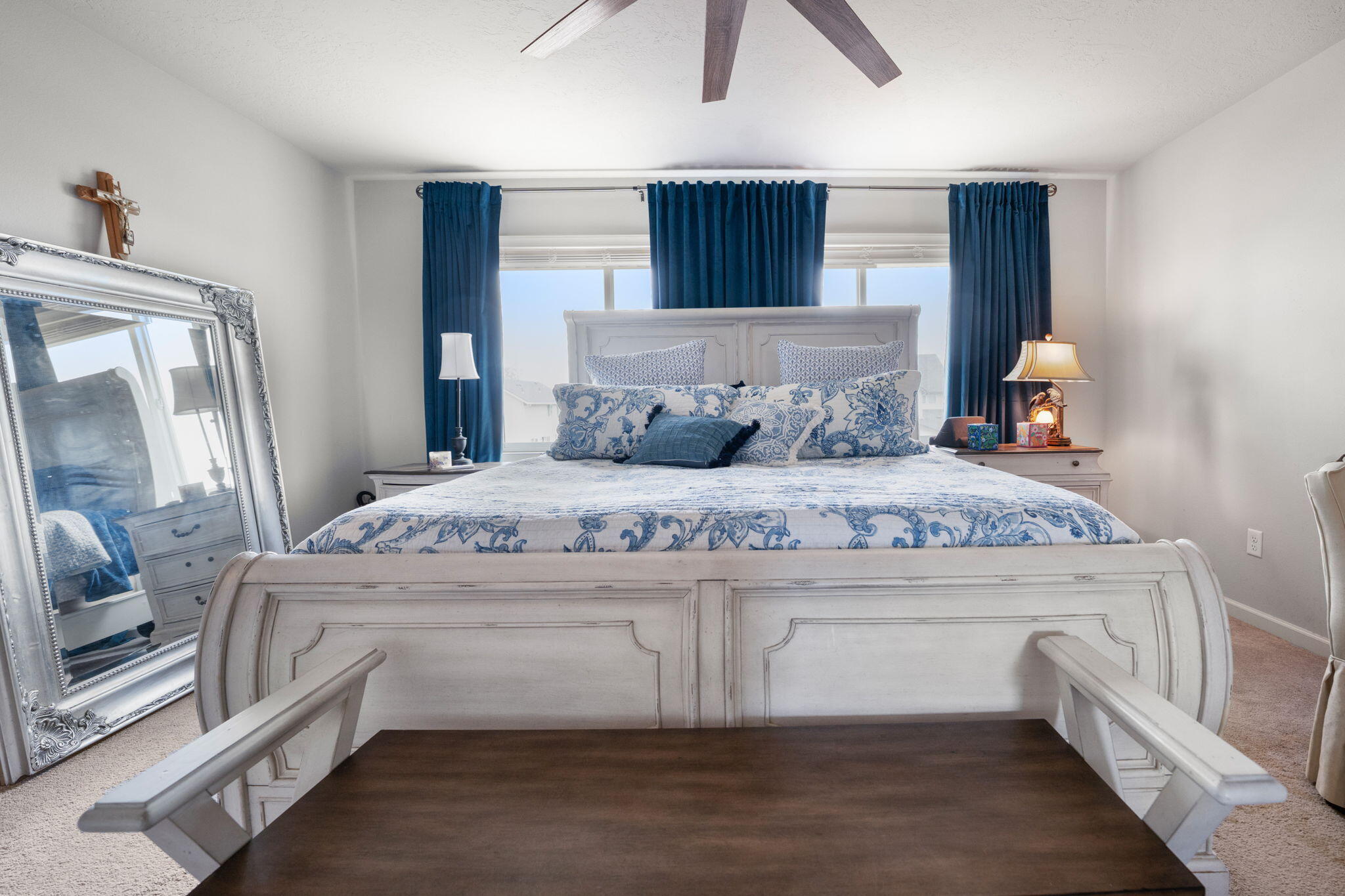 4039 Southwest Quartz Place Redmond, OR 97756 - Photo 32 of 44 a bedroom with a large bed and a chandelier