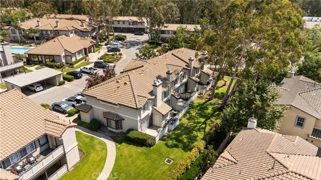 a view of a house with swimming pool and sitting area