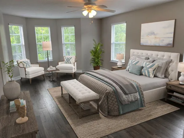 a bedroom with bed and a large window