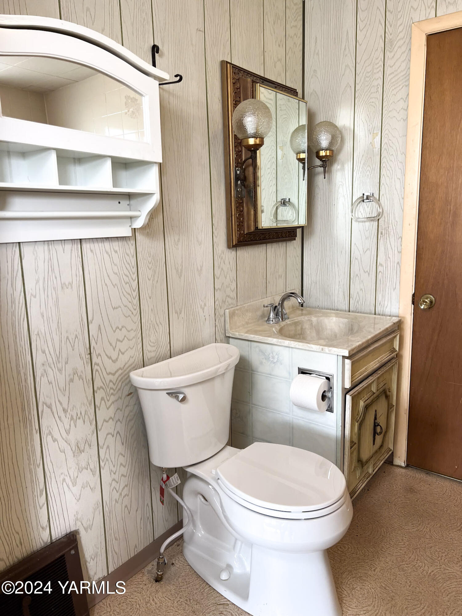 2011-2013 Forsell Road Grandview, WA 98930 - Photo 13 of 38 a bathroom with a sink a toilet and a mirror