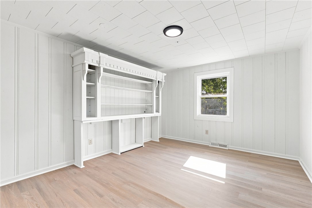 205 Timms Road Piedmont, SC 29673 - Photo 7 of 36 Smooth floors and matching paneled walls define this versatile room with built-in shelving.