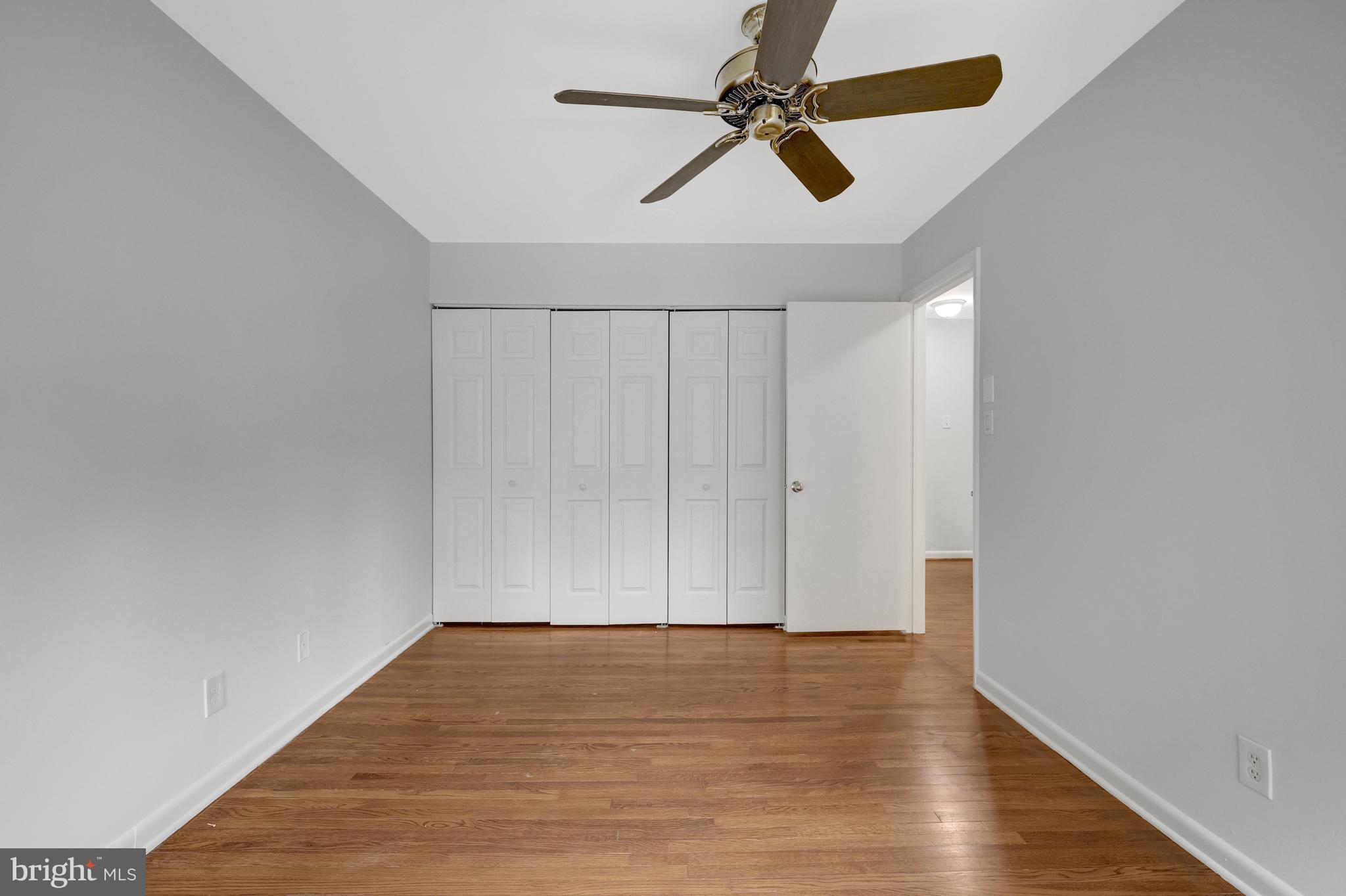 11063 Saffold Way Reston, VA 20190 - Photo 32 of 46 a view of room with hardwood floor and a ceiling fan