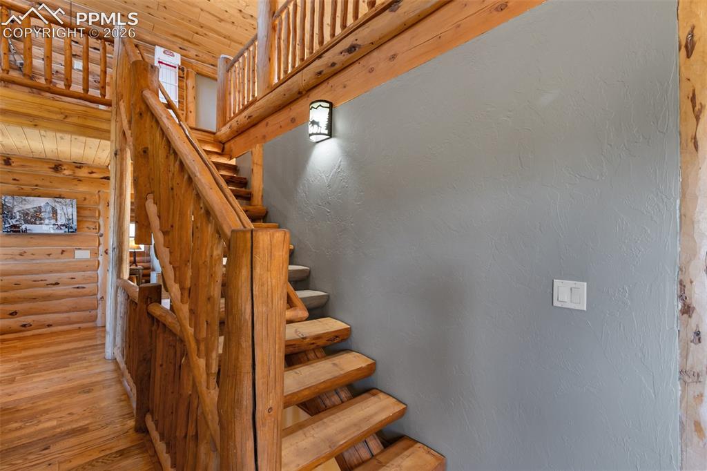 9110 Mountain Road Cascade, CO 80809 - Photo 17 of 49 a view of entryway with wooden floor