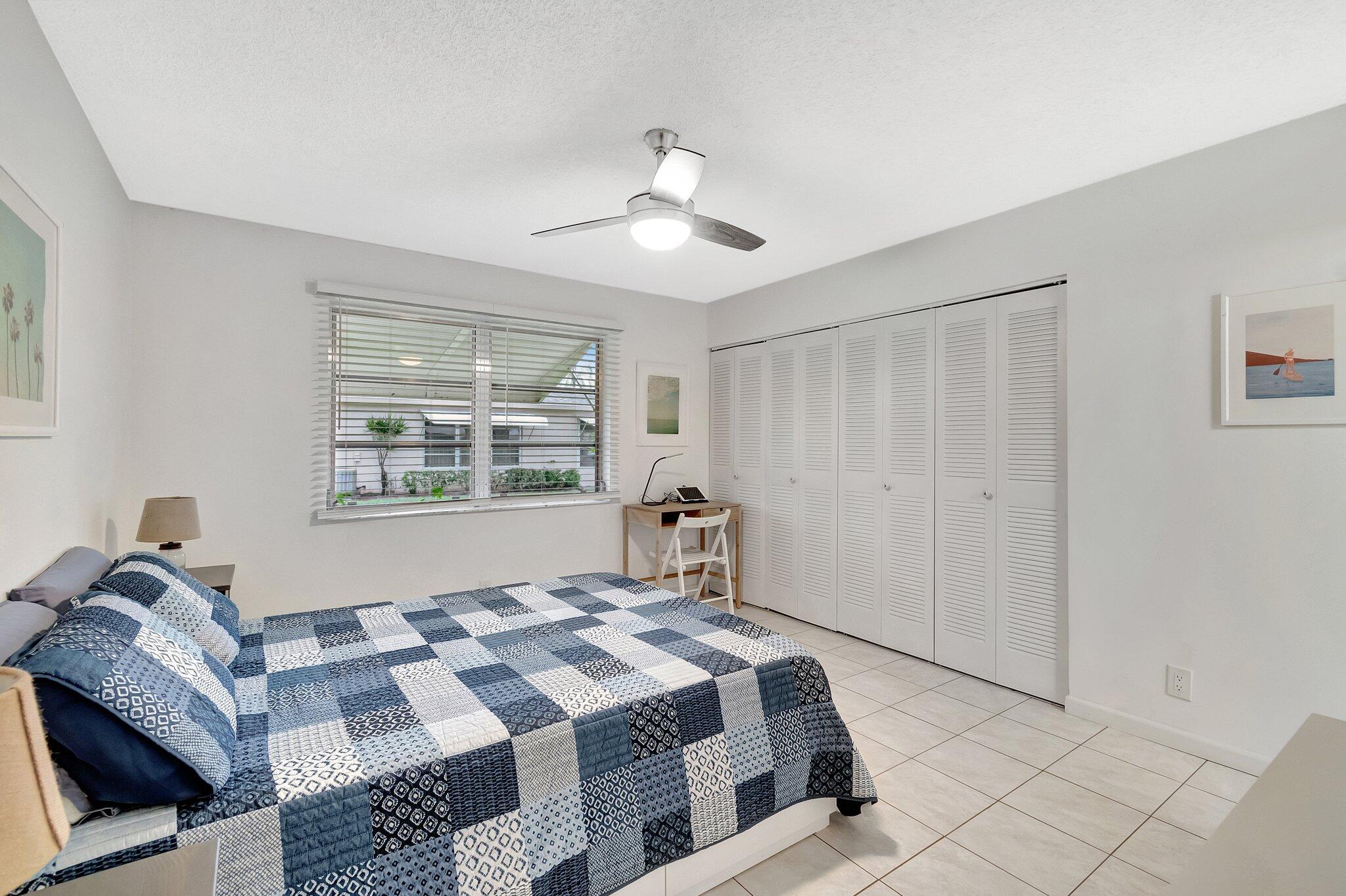 1375 High Point Way Southwest, Unit D Delray Beach, FL 33445 - Photo 26 of 54 Guest bedroom with plenty of closet spa