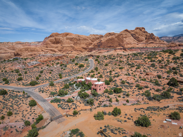3617 Red Rock Drive Moab, UT 84532 - Photo 65 of 79 View of mountain backdrop featuring a desert landscape and rural landscape