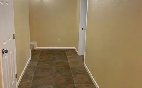 a view of hallway with a white wall
