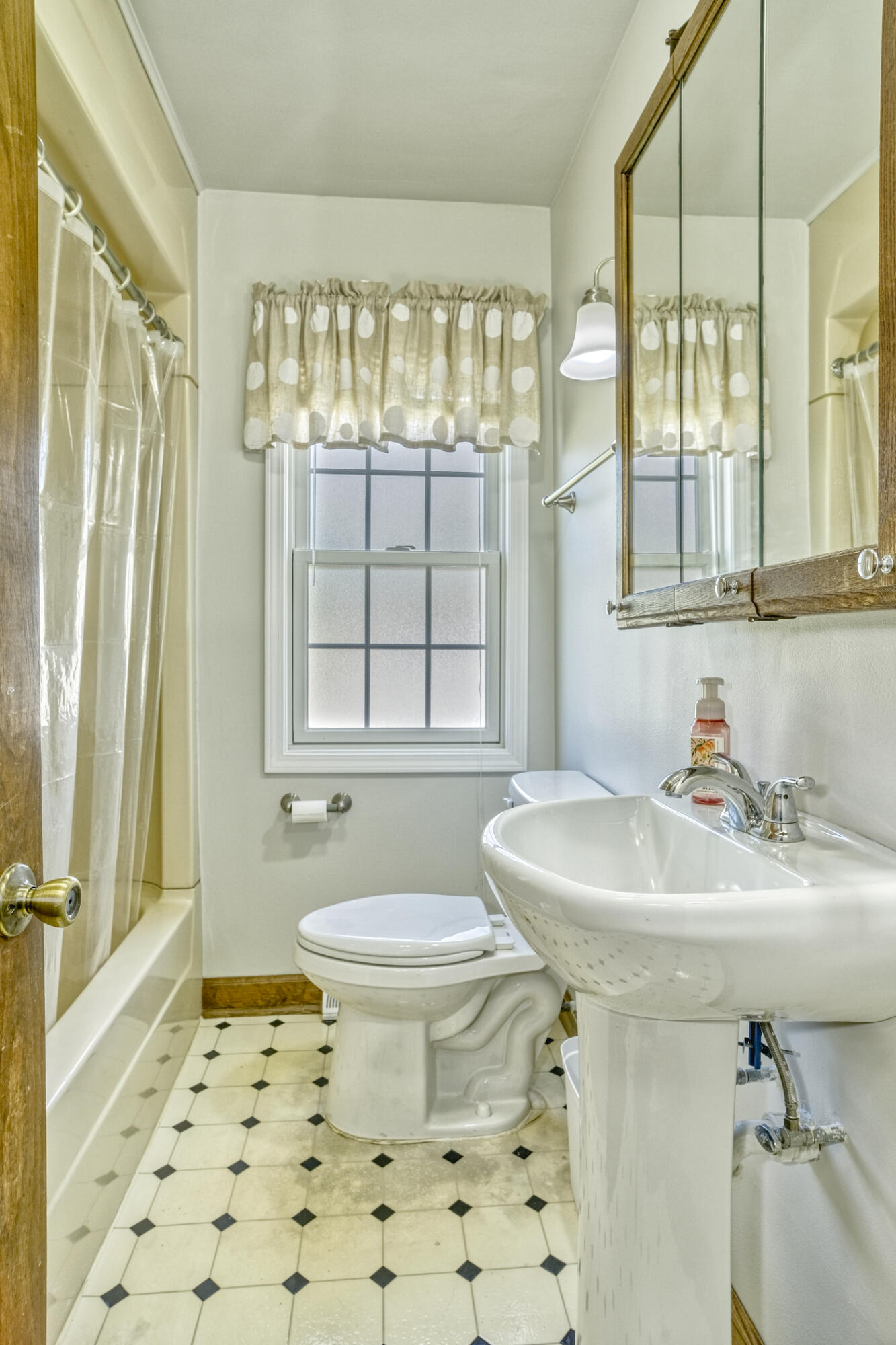 4912 West Main Street Lowell, IN 46356 - Photo 12 of 20 a bathroom with a sink toilet a mirror and shower