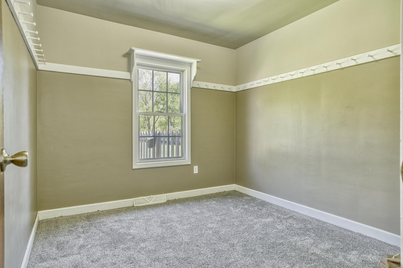 4912 West Main Street Lowell, IN 46356 - Photo 8 of 20 a view of an empty room with a window