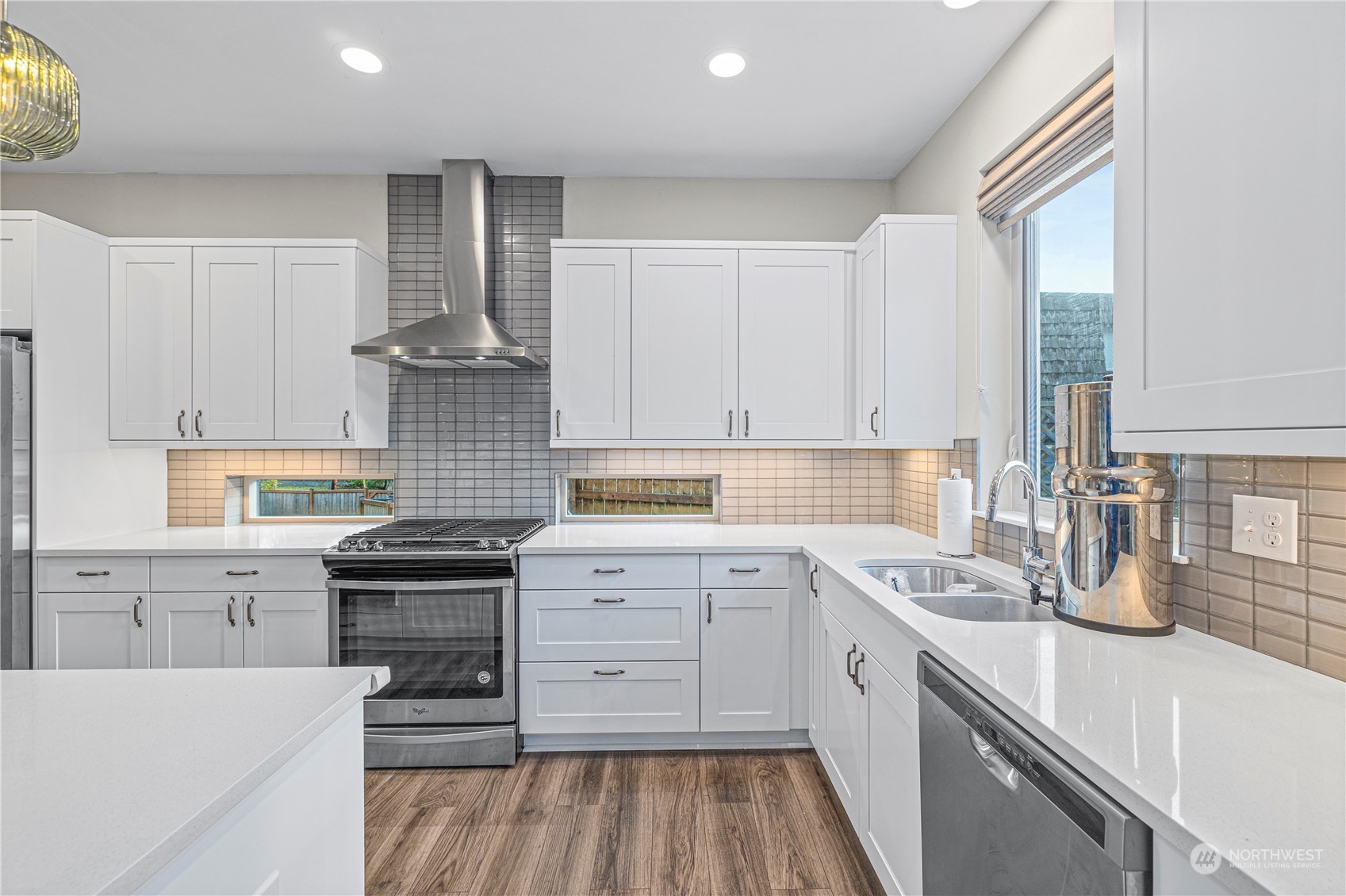 16614 Sylvester Road Southwest Burien, WA 98166 - Photo 11 of 40 a kitchen with a sink stove and cabinets