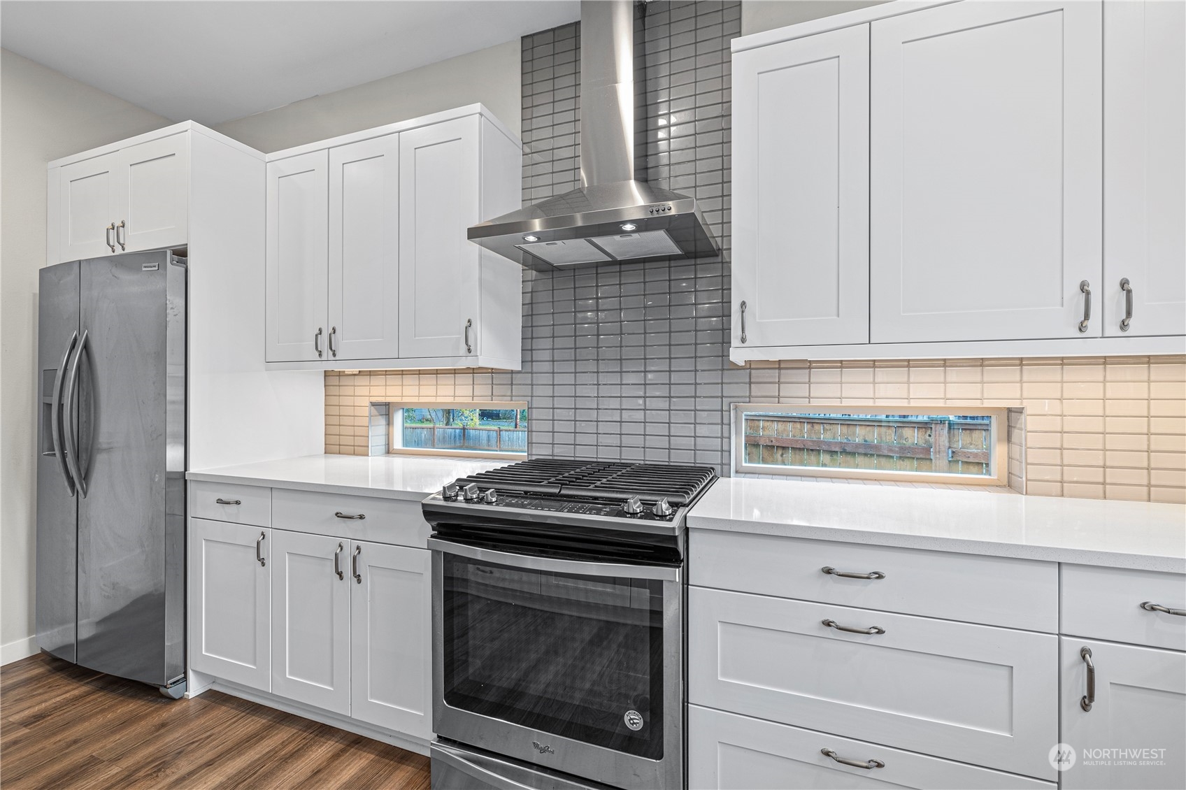 16614 Sylvester Road Southwest Burien, WA 98166 - Photo 12 of 40 a kitchen with granite countertop cabinets stainless steel appliances and a sink