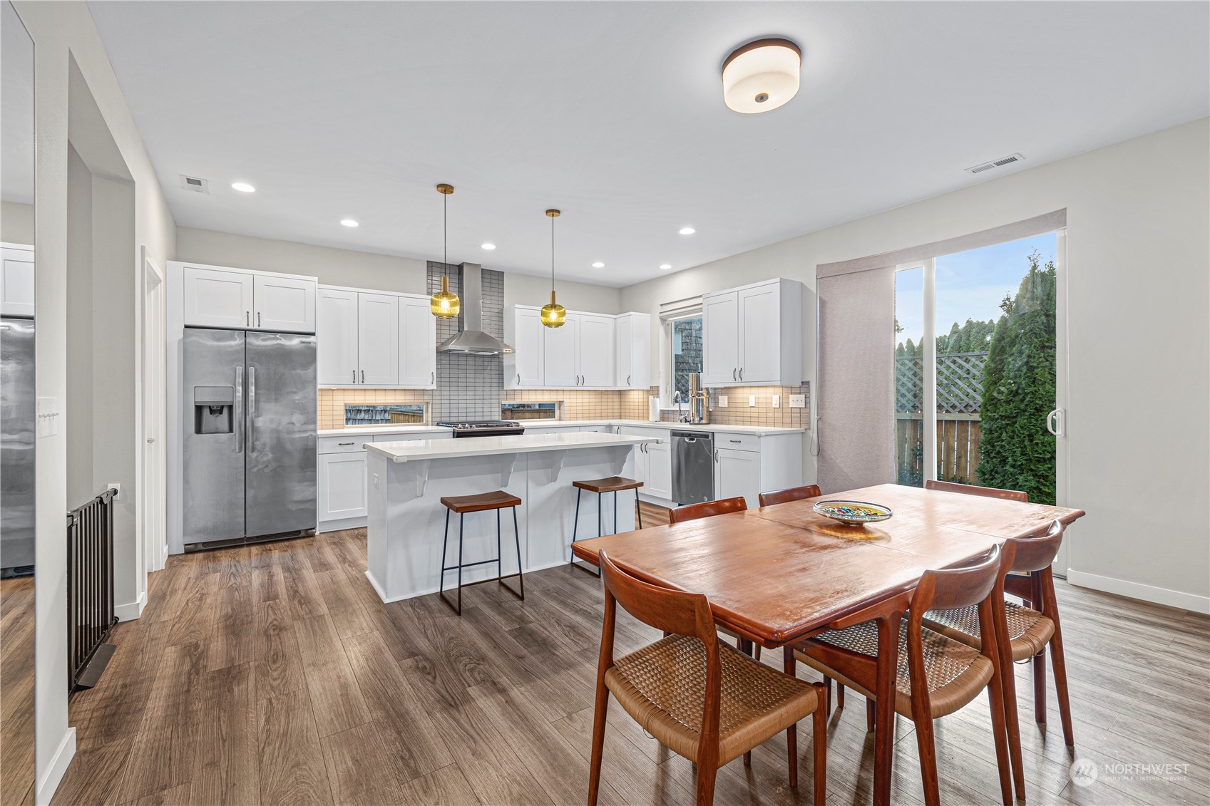 16614 Sylvester Road Southwest Burien, WA 98166 - Photo 16 of 40 a kitchen with a table and chairs in it