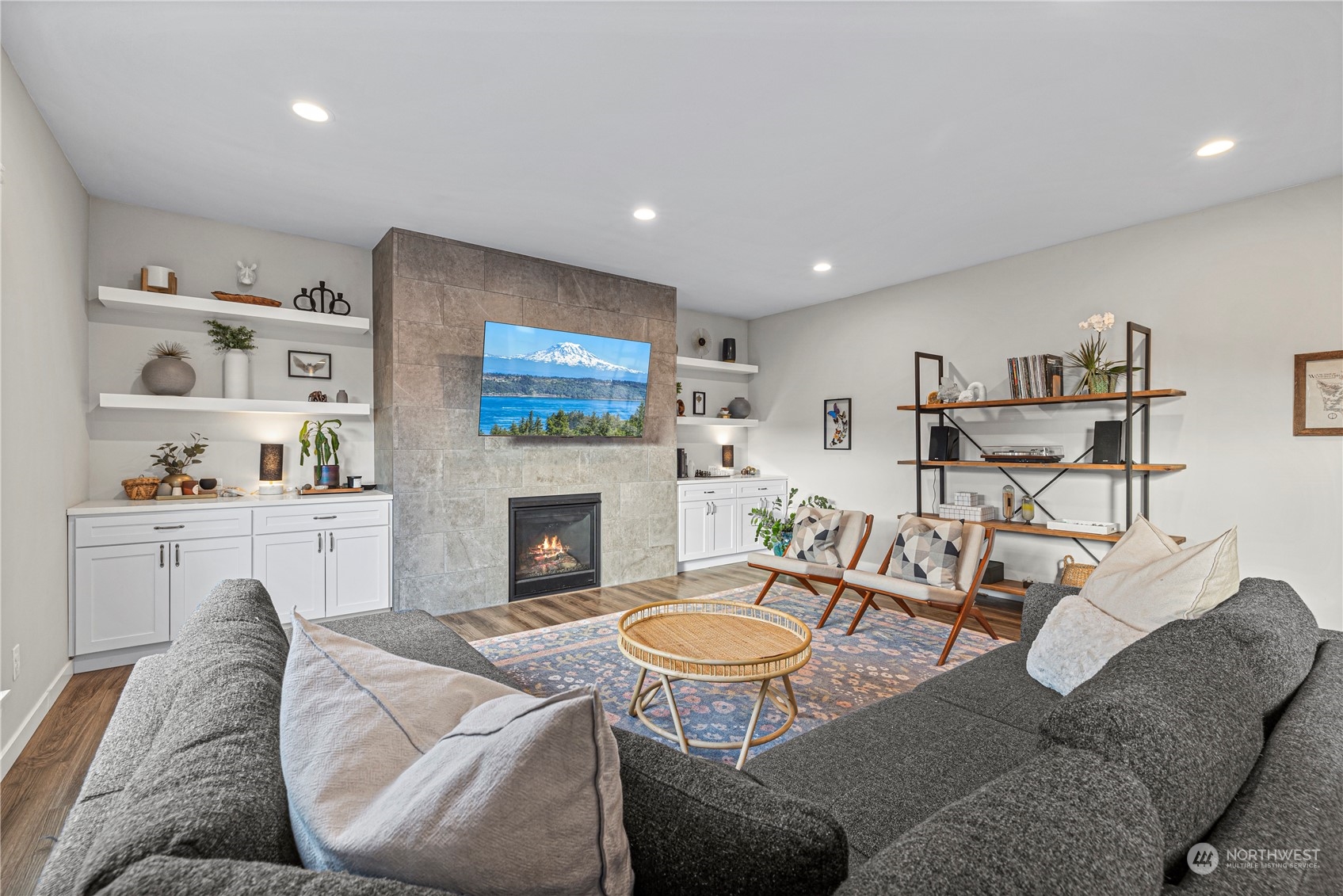 16614 Sylvester Road Southwest Burien, WA 98166 - Photo 18 of 40 a living room with furniture a fireplace and wall paintings