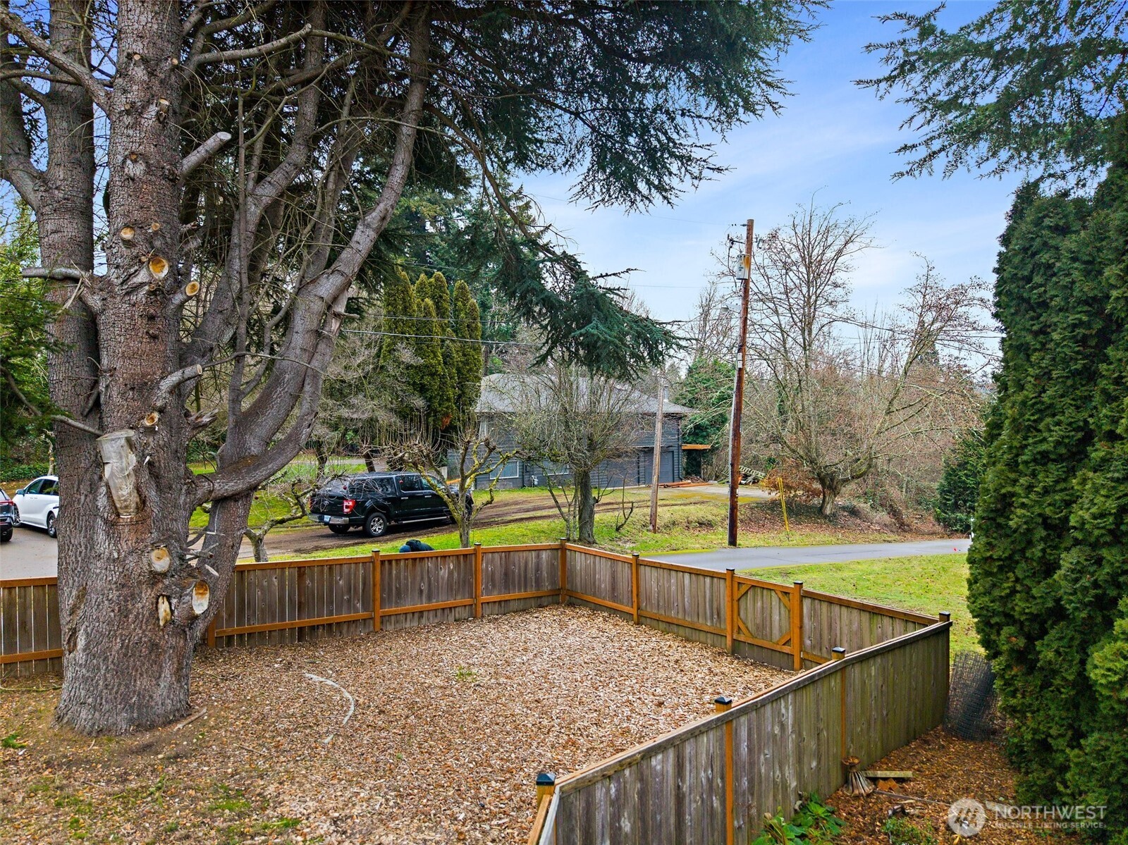 16614 Sylvester Road Southwest Burien, WA 98166 - Photo 2 of 40 a view of a balcony with floor to ceiling windows and a table and chairs