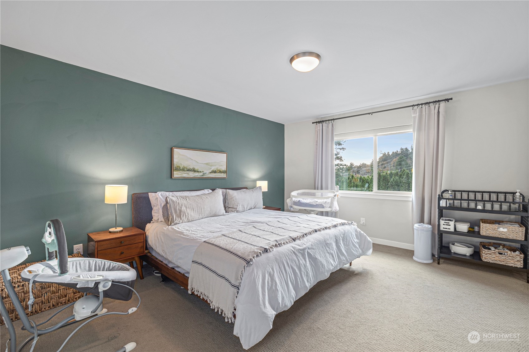 16614 Sylvester Road Southwest Burien, WA 98166 - Photo 21 of 40 a bedroom with a bed a couch and a window