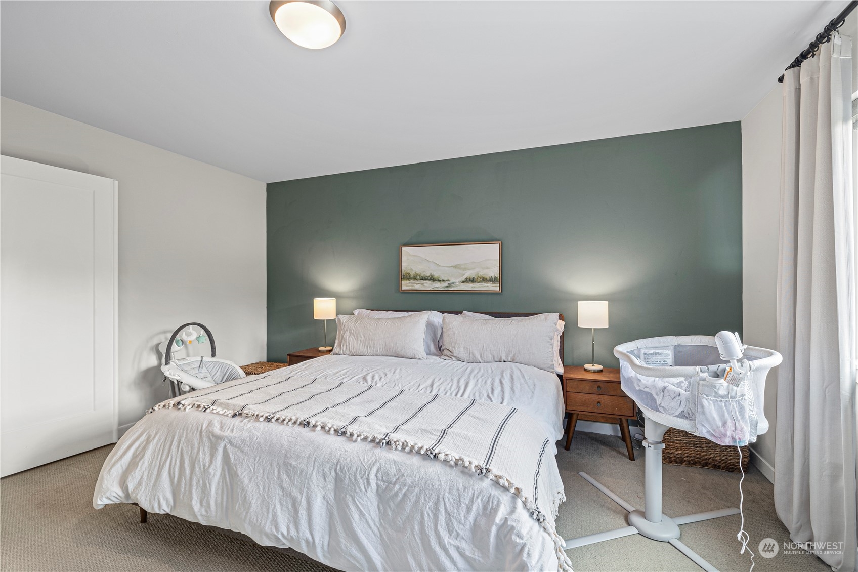 16614 Sylvester Road Southwest Burien, WA 98166 - Photo 22 of 40 a bedroom with a bed and a lamp