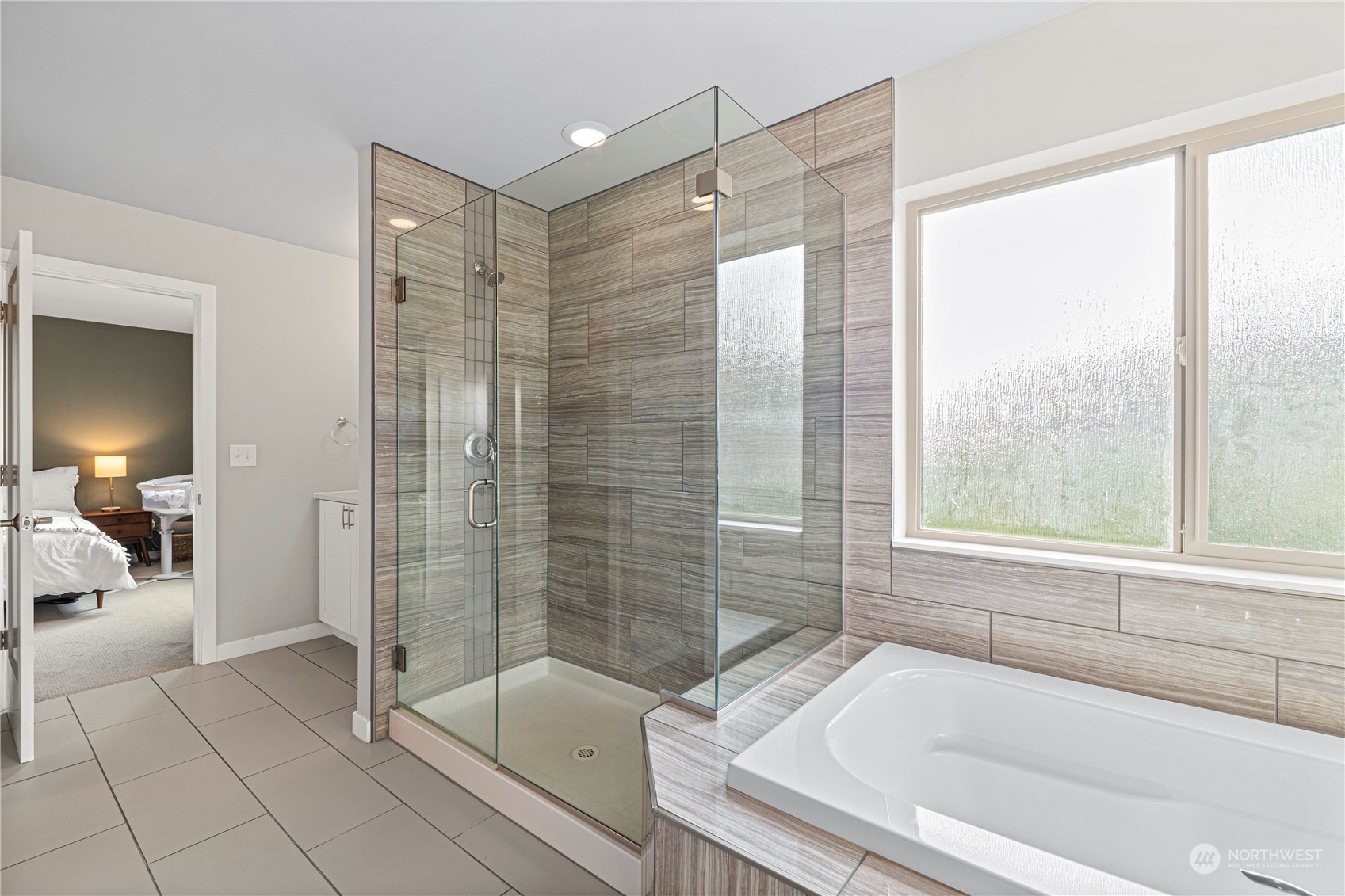 16614 Sylvester Road Southwest Burien, WA 98166 - Photo 24 of 40 a bathroom with a bathtub and a shower