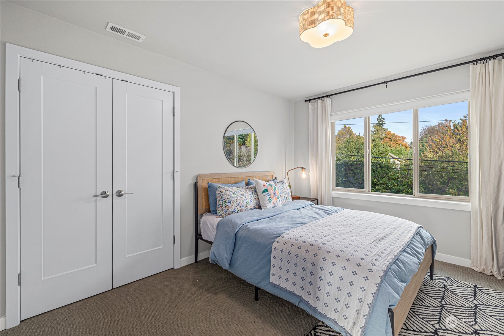 16614 Sylvester Road Southwest Burien, WA 98166 - Photo 27 of 40 a bedroom with a large bed and a window