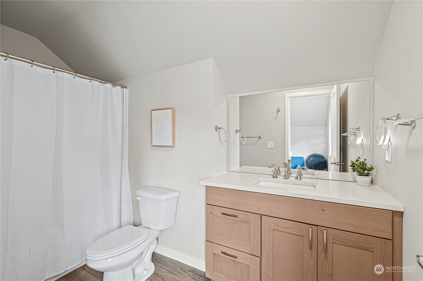 16614 Sylvester Road Southwest Burien, WA 98166 - Photo 33 of 40 a bathroom with a sink a toilet and a mirror
