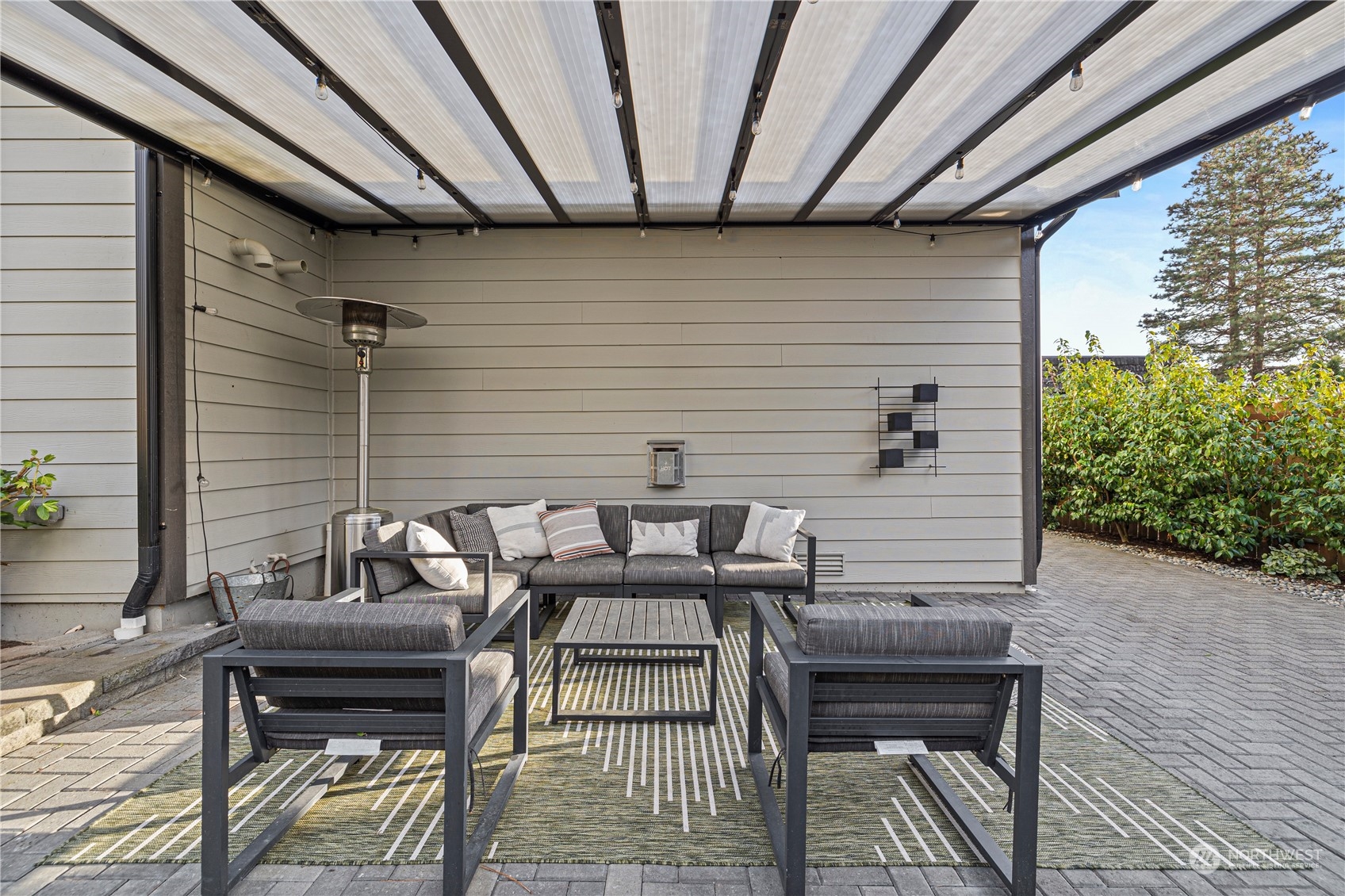 16614 Sylvester Road Southwest Burien, WA 98166 - Photo 35 of 40 a view of a patio with table and chairs with wooden floor and fence