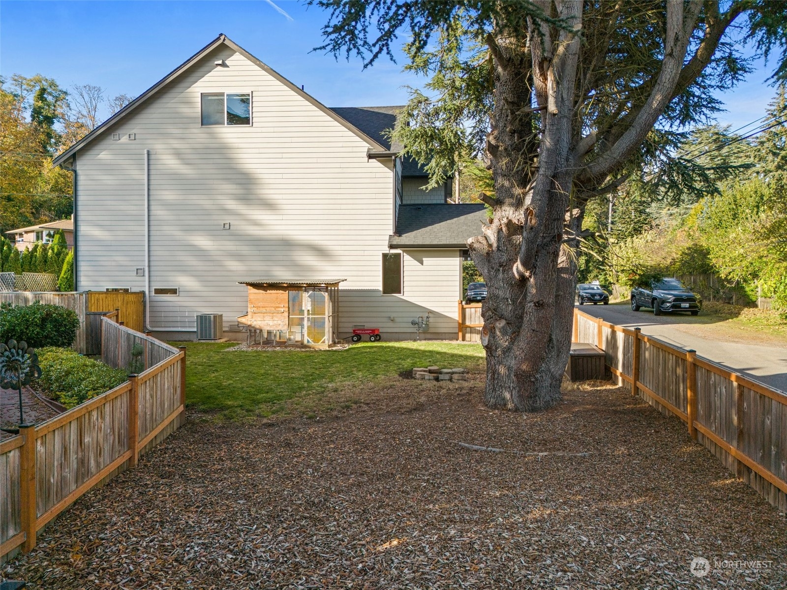 16614 Sylvester Road Southwest Burien, WA 98166 - Photo 38 of 40 a view of house with backyard and trees