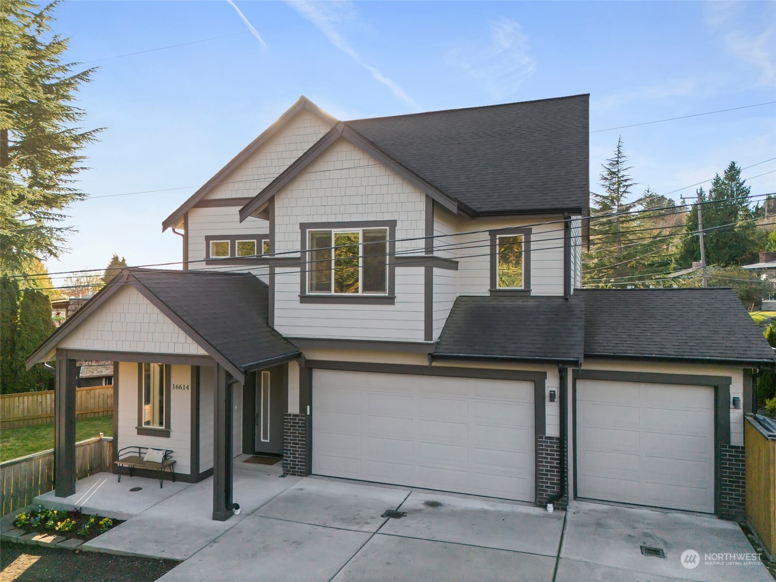 16614 Sylvester Road Southwest Burien, WA 98166 - Photo 4 of 40 a front view of a house with garage