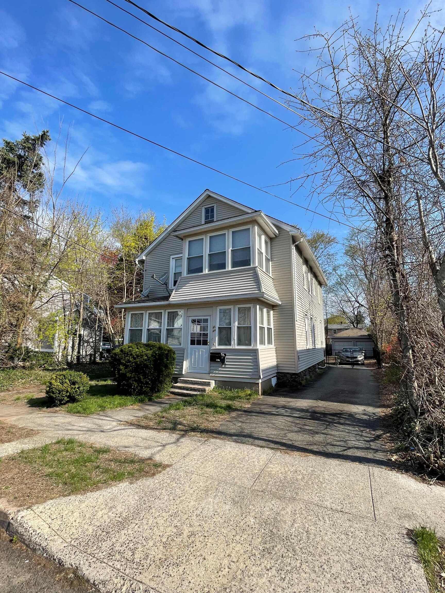 Undisclosed Address Wallingford, CT 06492 - Photo 1 of 1 a front view of a house with a yard