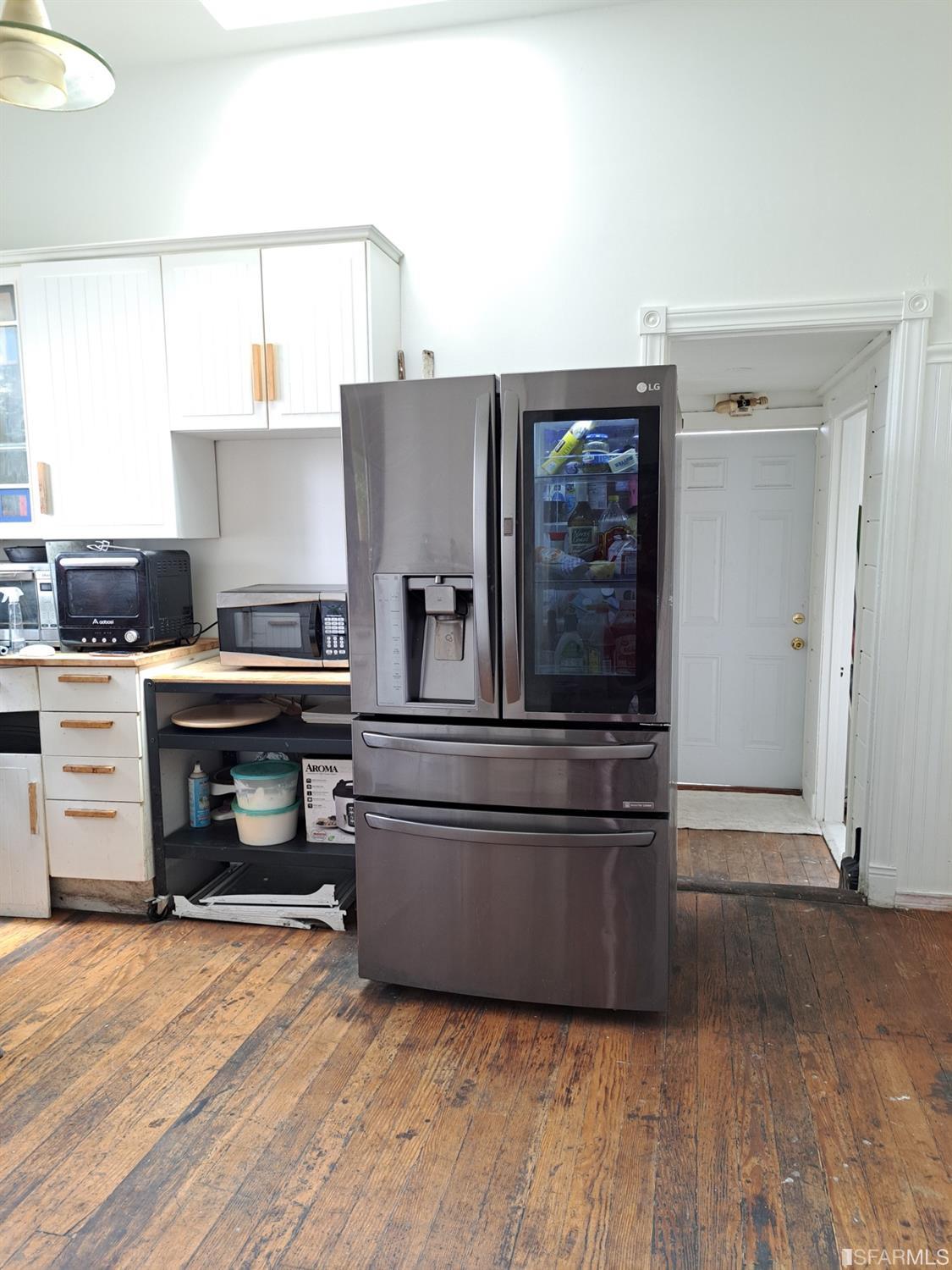 1930 55th Avenue Oakland, CA 94621 - Photo 20 of 25 a kitchen with granite countertop a stove and a refrigerator
