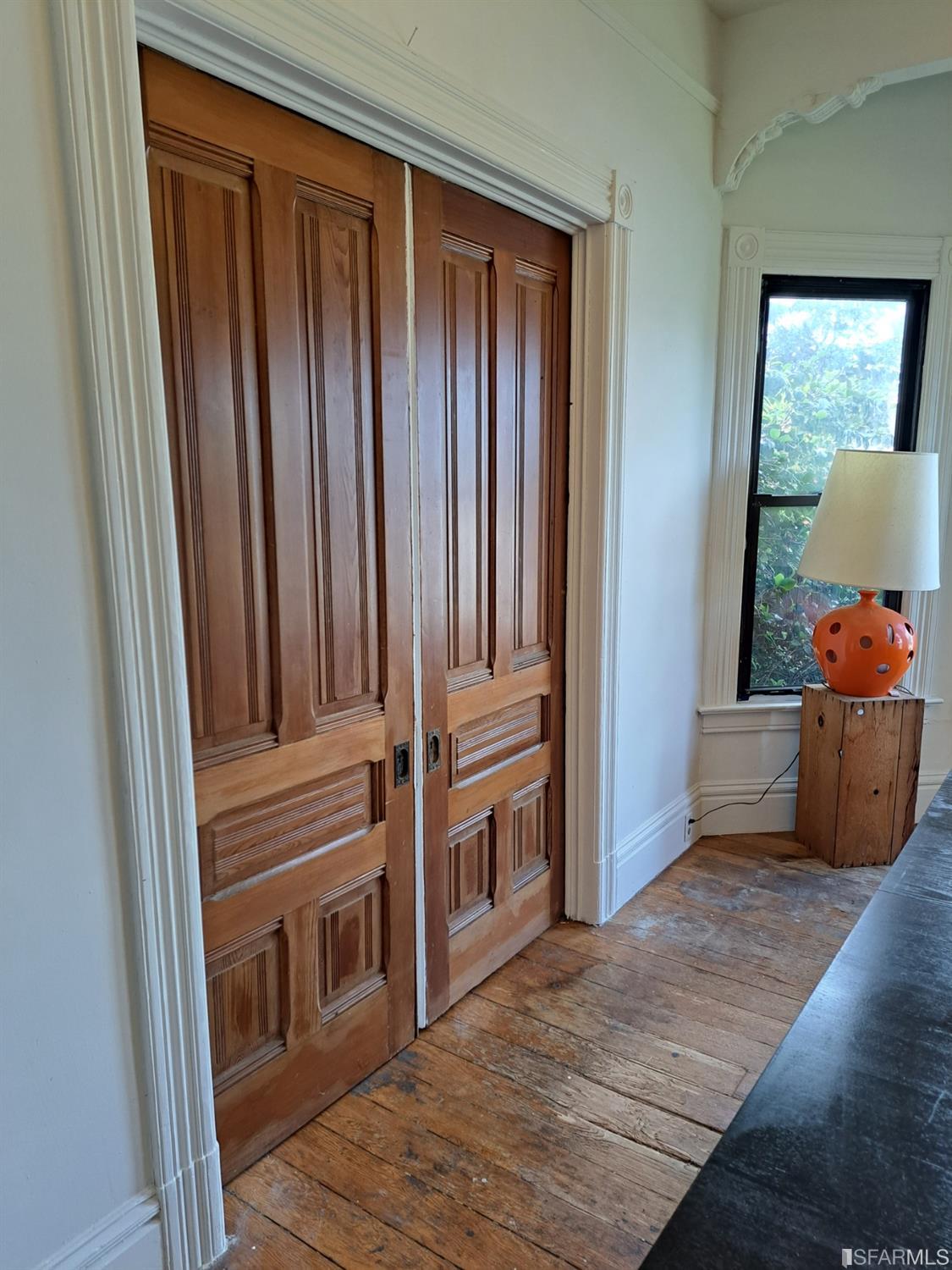 1930 55th Avenue Oakland, CA 94621 - Photo 25 of 25 a view of a hallway with entryway wooden floor and cabinet