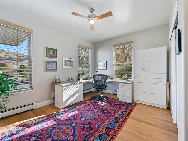 a bed room with a bed and a window