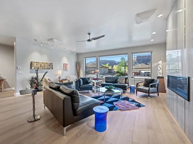 a living room with furniture and a large window