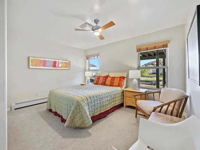 a bedroom with a bed and a couch