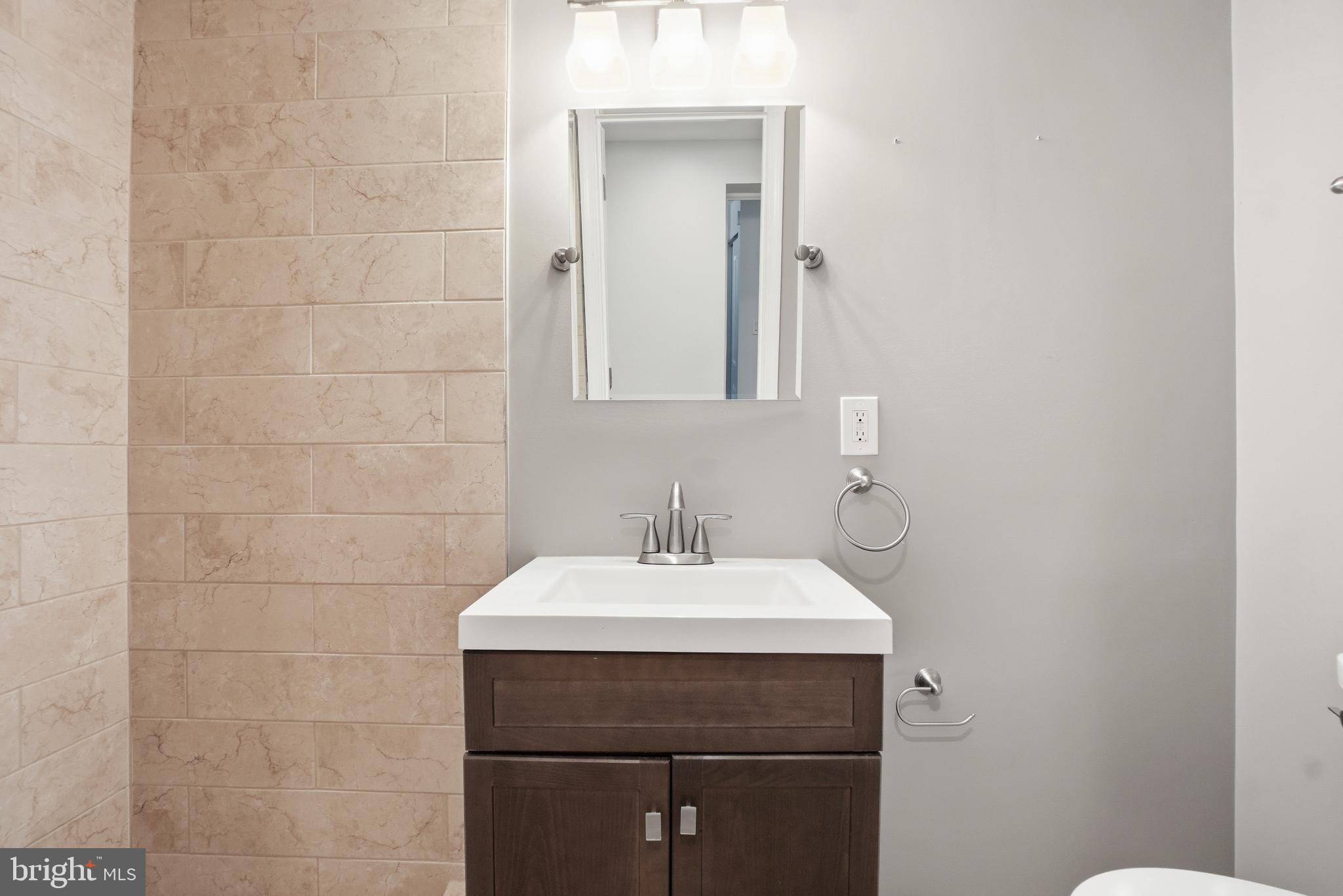 1118 Chicago Street Southeast Washington, DC 20020 - Photo 10 of 27 Modern bathroom with sleek finishes.