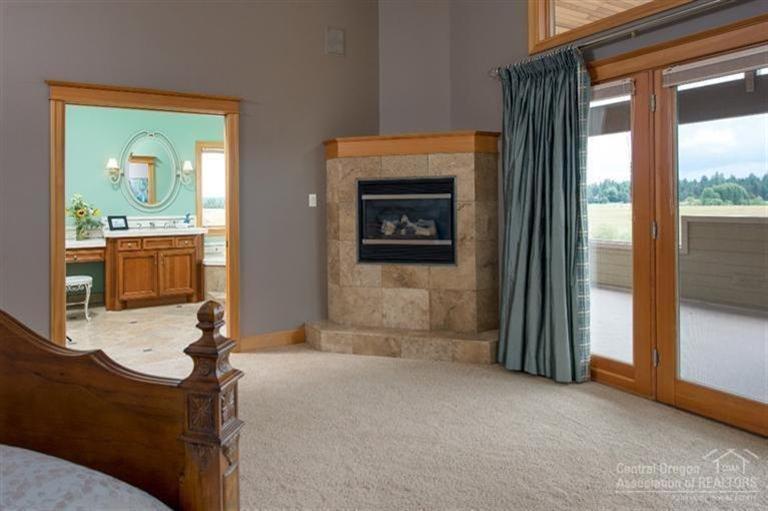 3 River Road Sunriver, OR 97707 - Photo 10 of 25 Light stone surrounds the gas fireplace,
