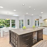 a kitchen with a stove a sink and a refrigerator