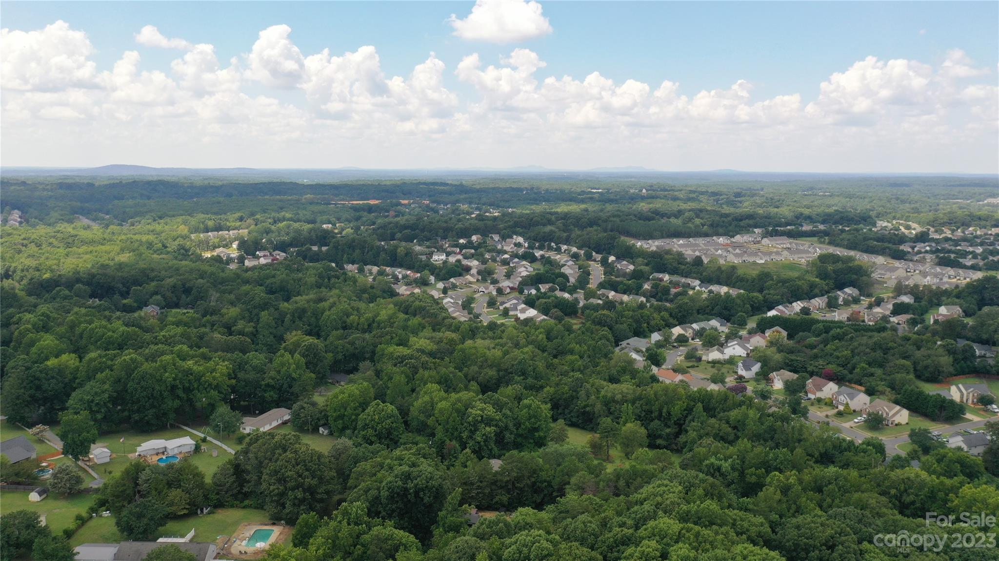 3284 Farmcrest Court Fort Mill, SC 29708 - Photo 13 of 14 an aerial view of residential house with green space and fog