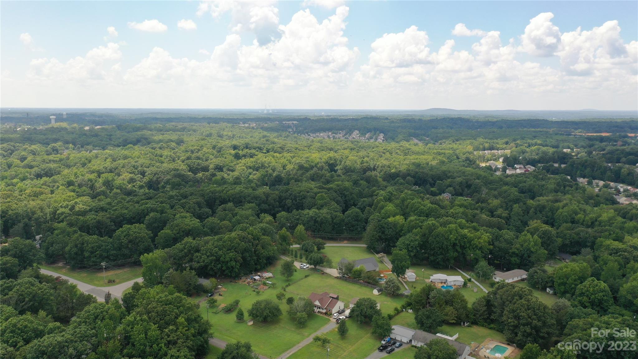 3284 Farmcrest Court Fort Mill, SC 29708 - Photo 14 of 14 an aerial view of houses covered in trees