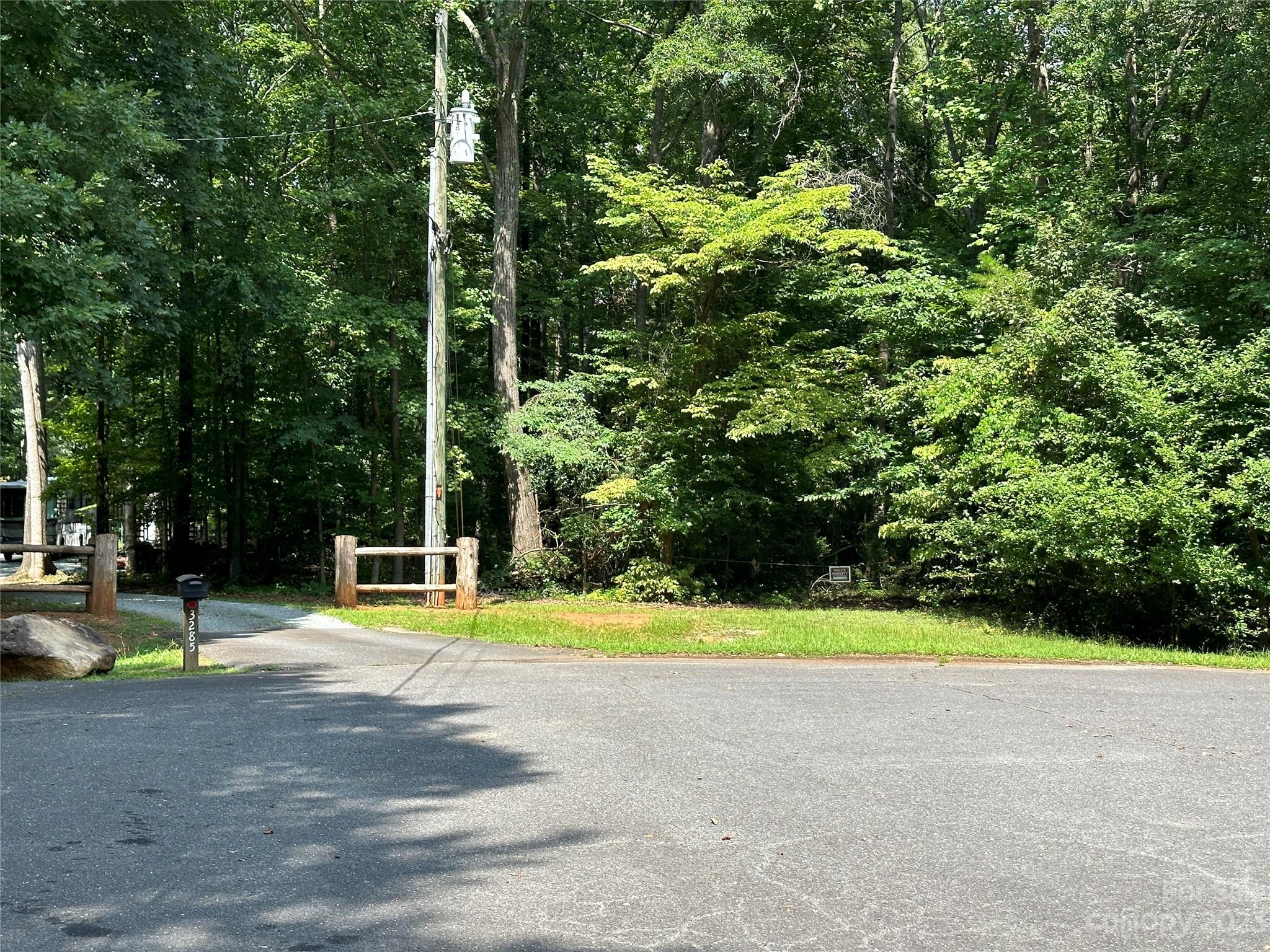 3284 Farmcrest Court Fort Mill, SC 29708 - Photo 5 of 14 a view of swimming pool with lawn chairs and large trees