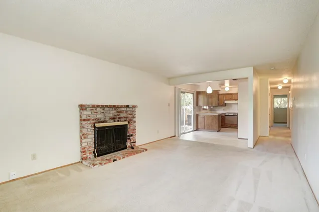 a kitchen with a refrigerator a sink and cabinets