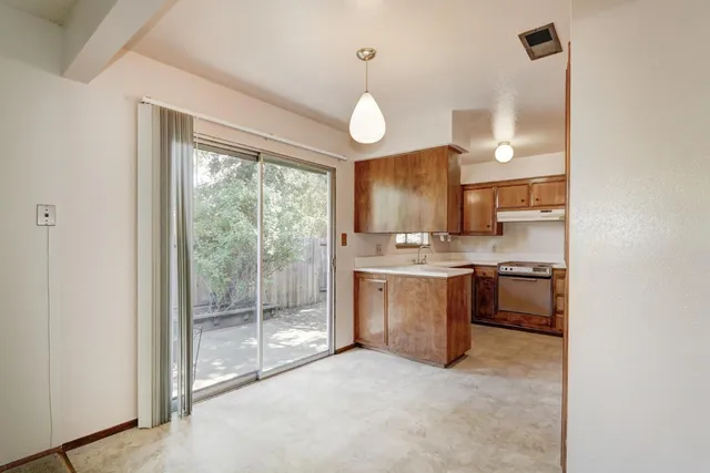 a view of a kitchen with a sink