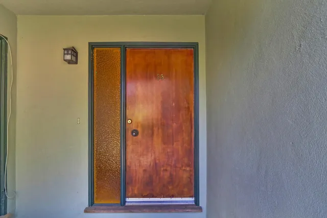 a view of a bathroom from a hallway