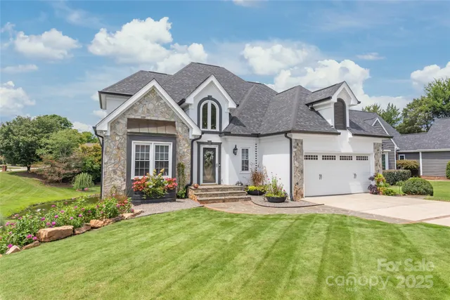 a front view of a house with garden