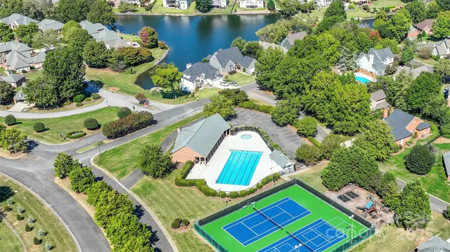 an aerial view of a house with outdoor space swimming pool and outdoor seating