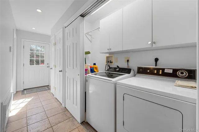 a view of storage and utility room with washer and dryer