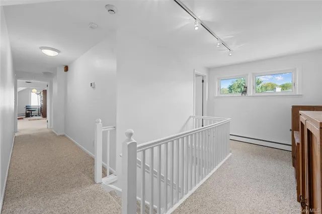 a view of hallway with livingroom