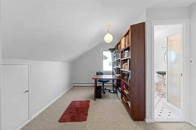 a view of a livingroom with furniture and a window