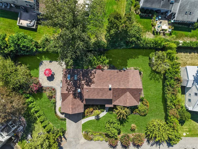 an aerial view of house with outdoor space and swimming pool