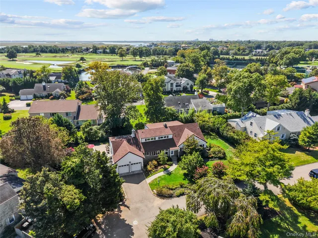 an aerial view of residential house with outdoor space and river