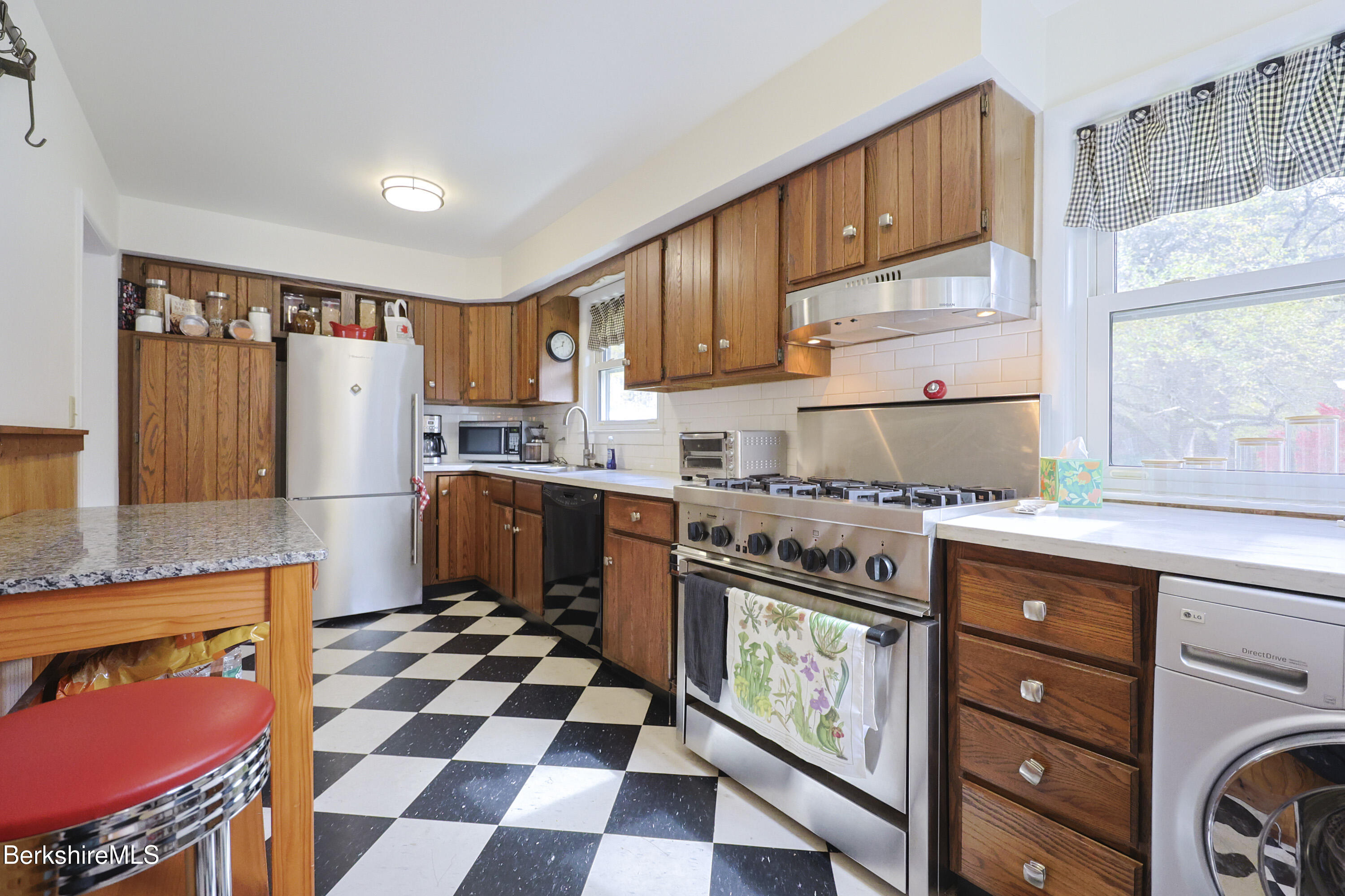 16 East New Lenox Road Lenox, MA 01240 - Photo 8 of 31 a kitchen with stainless steel appliances granite countertop a stove a sink and a refrigerator