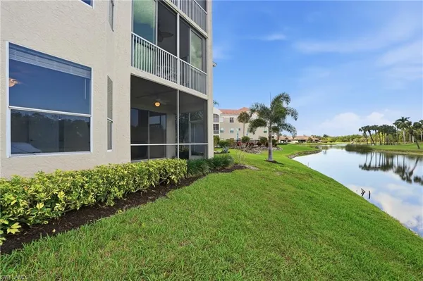 a view of a lake with a big yard