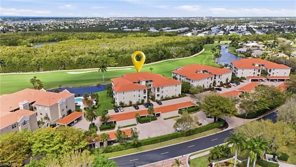 an aerial view of residential houses with outdoor space and river